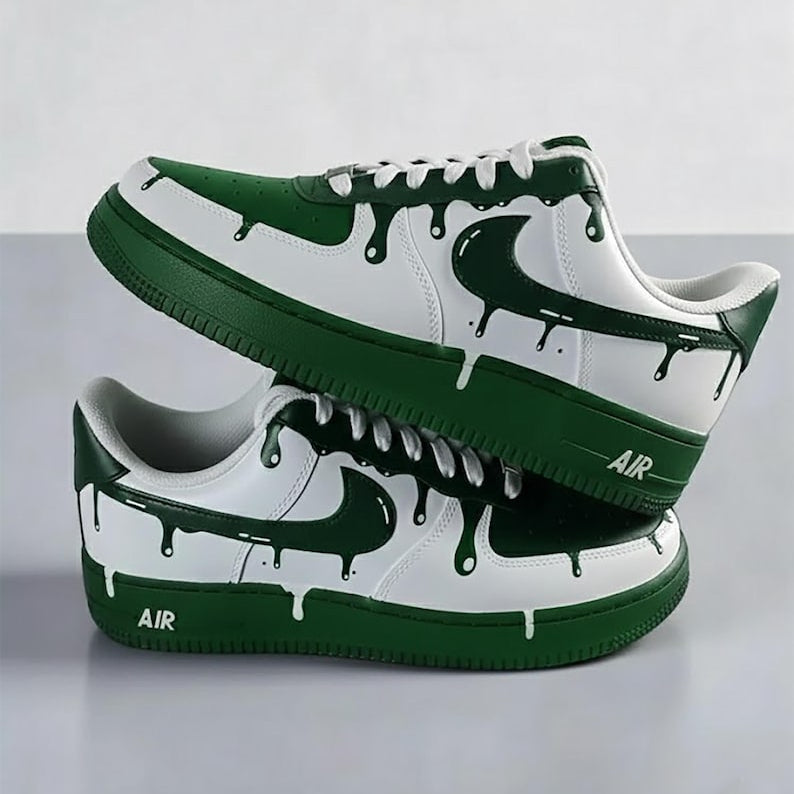 Green and white sneakers with a dripping design on a gray background